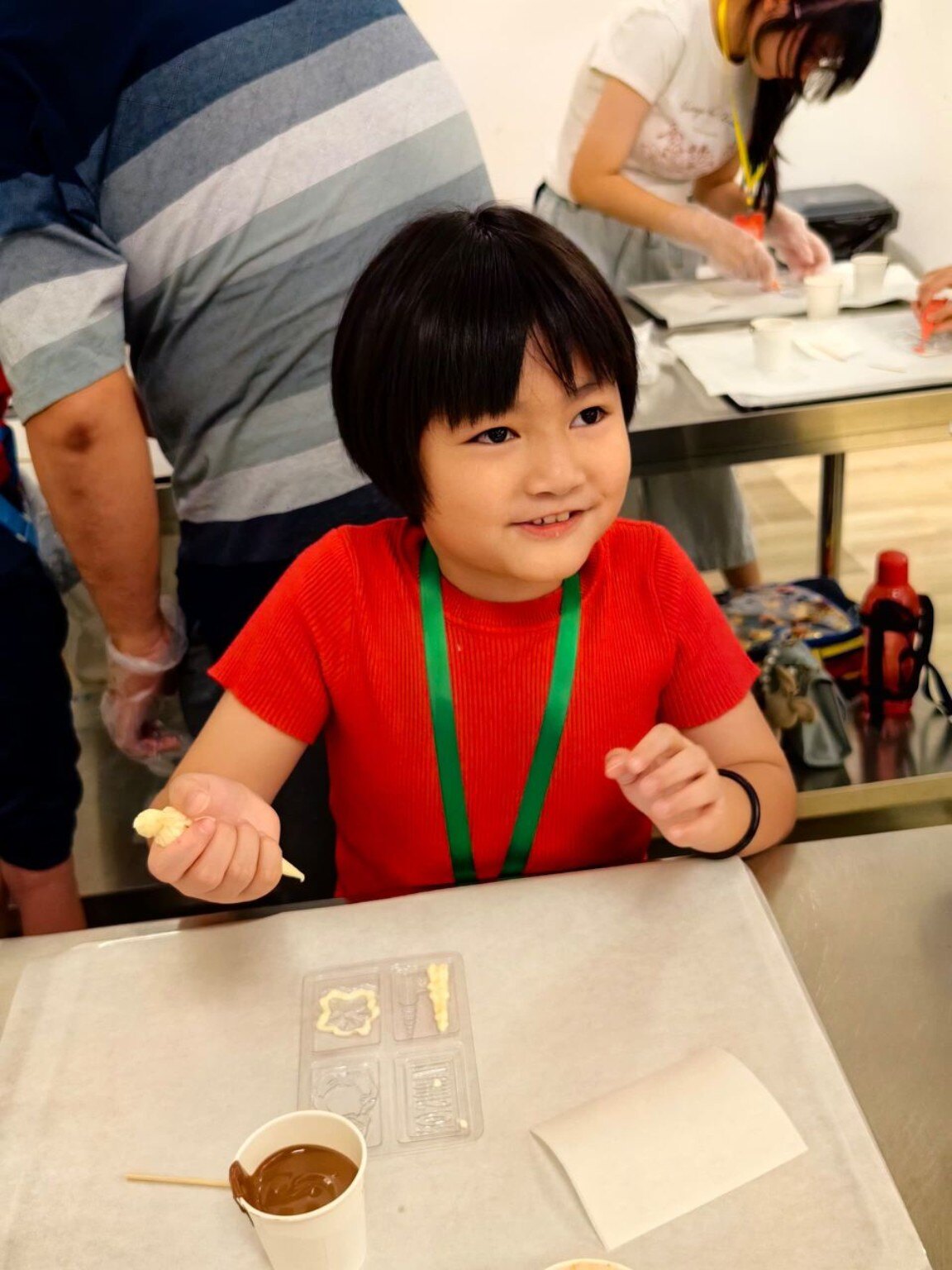 Young participant enjoying a creative hands-on workshop